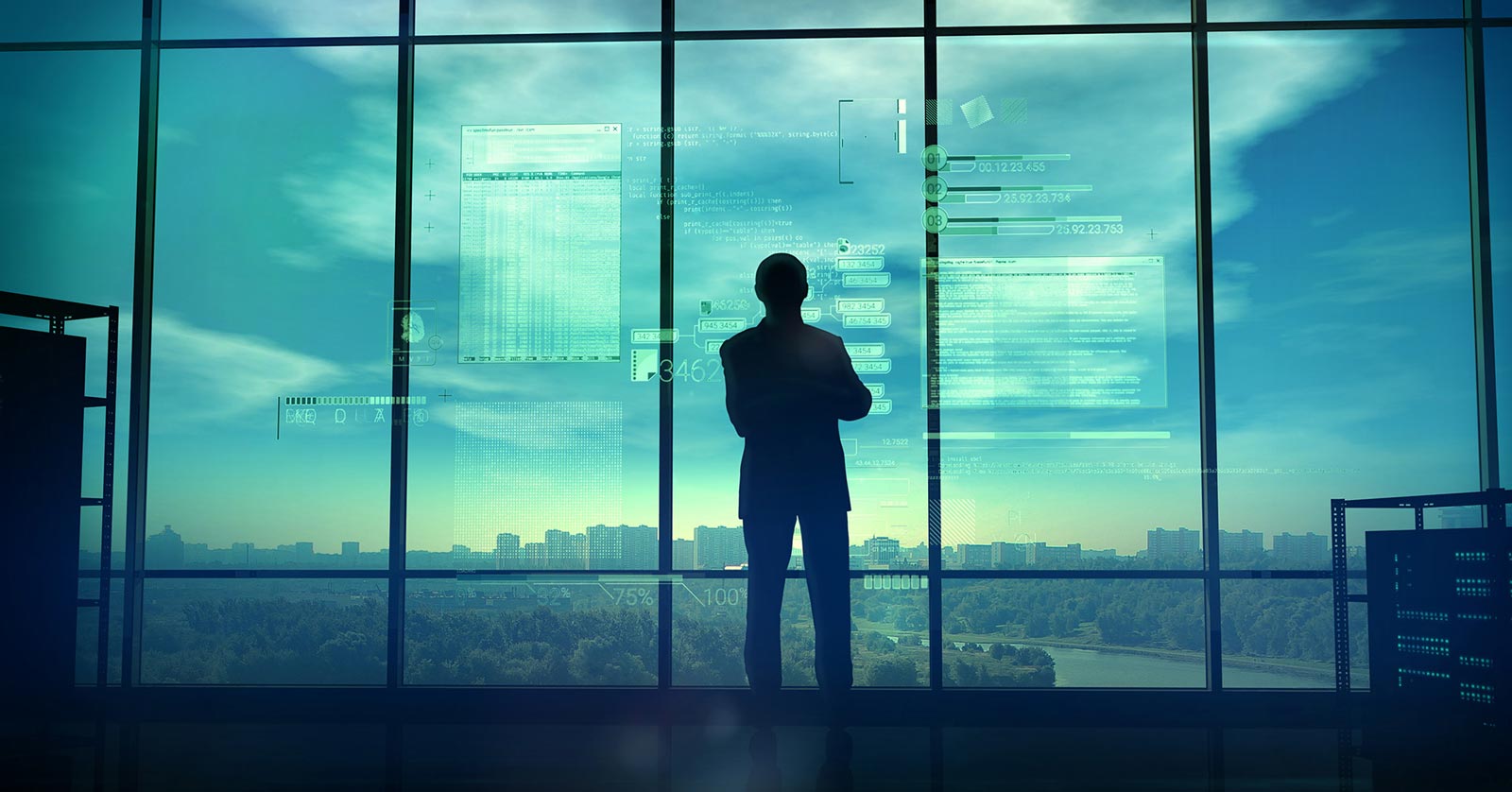 Man standing in front of high rise window with digital interface