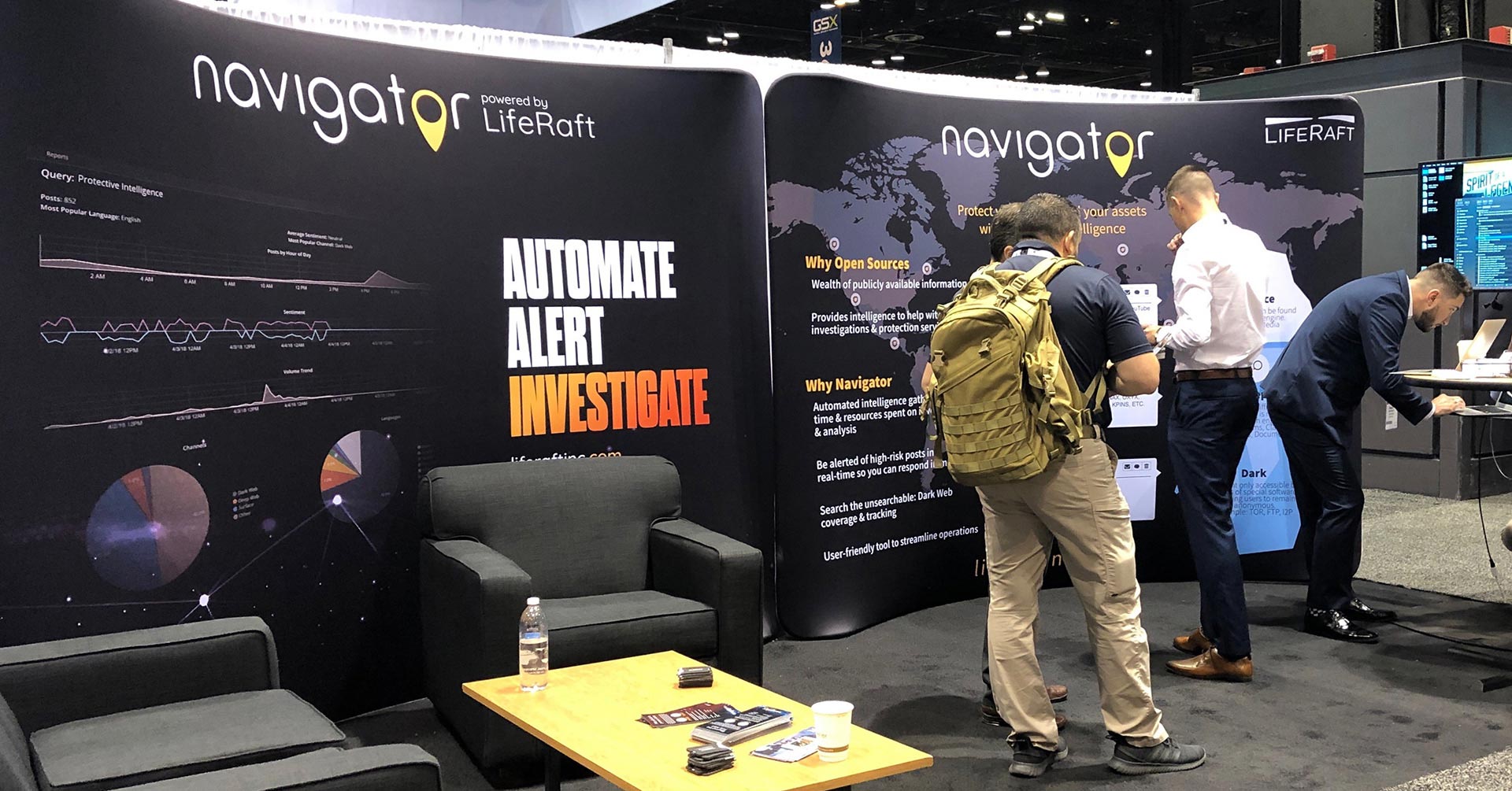 Conference attendees standing in front of the Navigator powered by LifeRaft booth