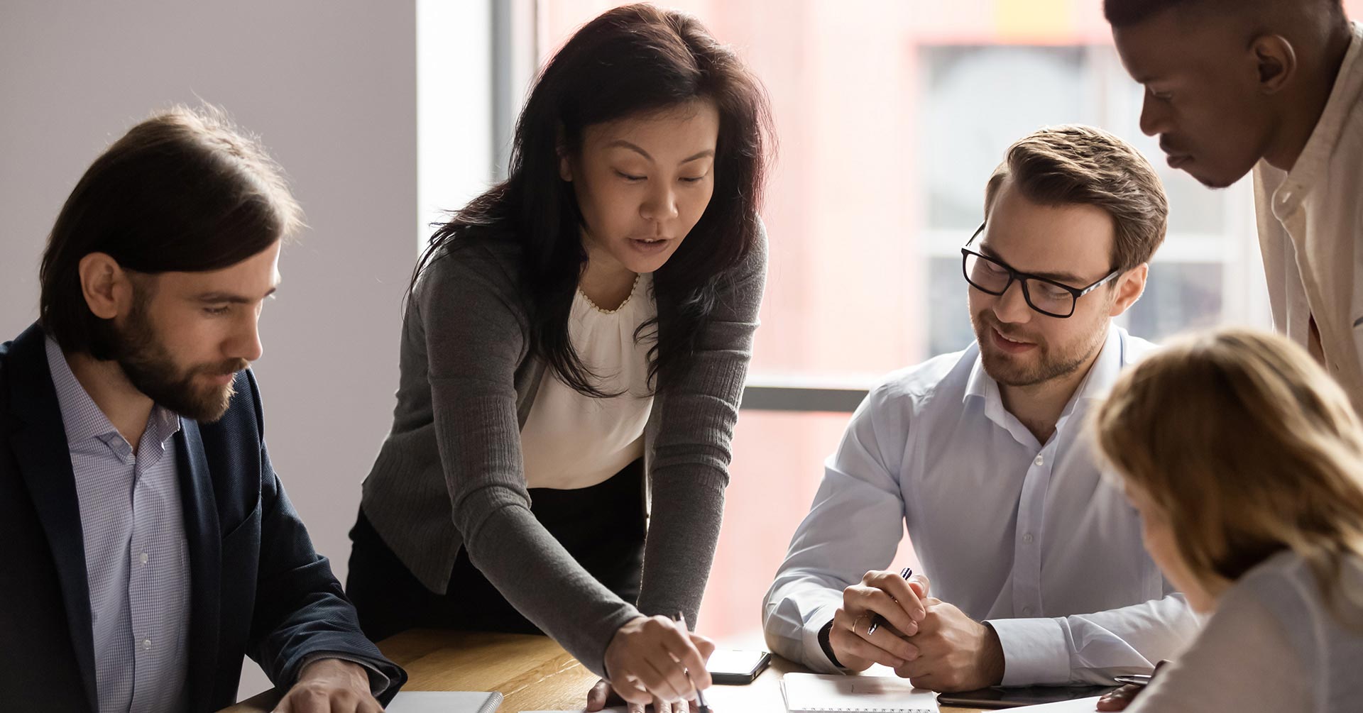 A manager explaining something work-related to her team