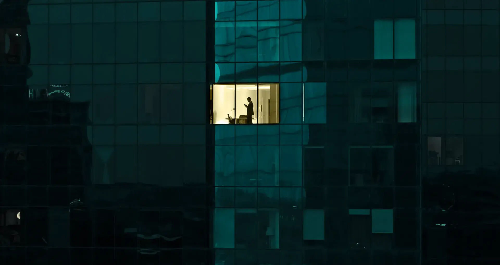 Image of an executive in an office window