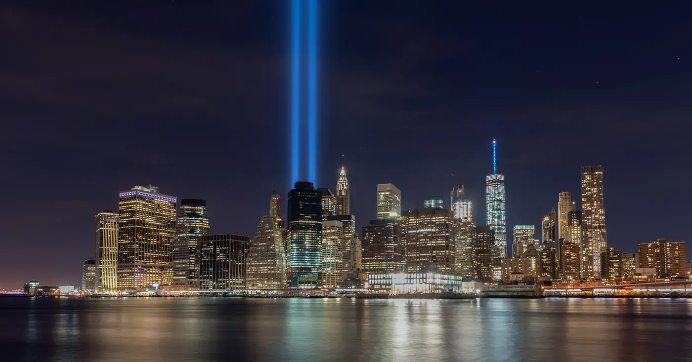 Lower Manhattan skyline at night with the Tribute in Light beams shining upward in remembrance of September 11.