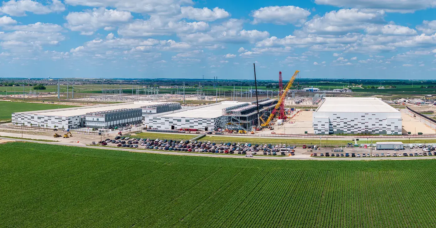 Aerial view of a large data center campus under construction, representing AI infrastructure and the physical security risks explored in Liferaft’s threat landscape report.