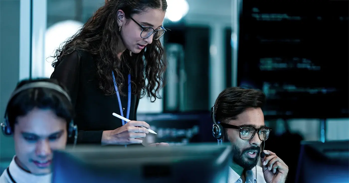 Security operations center analysts monitoring digital threats across multiple screens as part of an integrated OSINT workflow.