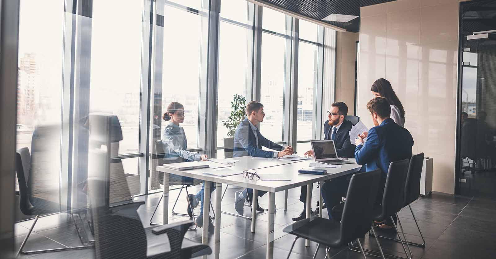 executives having a meeting in a boardroom