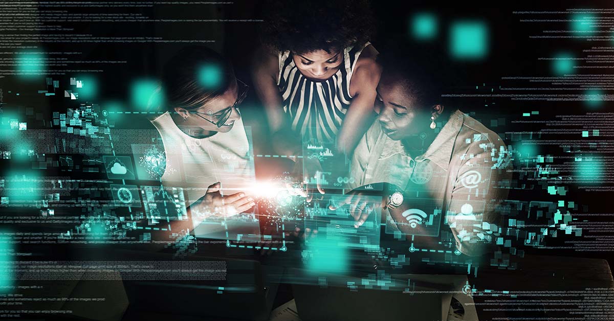 Three women viewing a laptop on a desk, technology graphic overlay