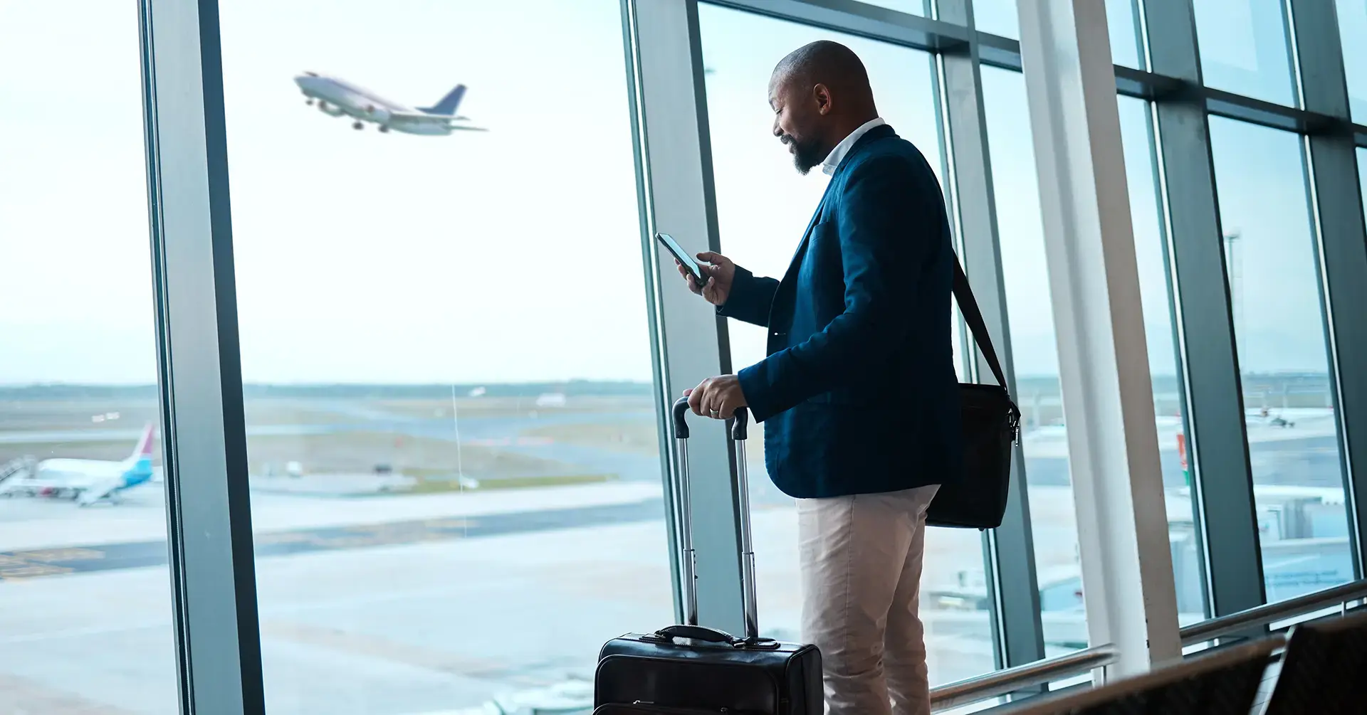 Corporate traveler preparing to board a flight, aligned with OSINT checklists for assessing threats and securing executive movements.