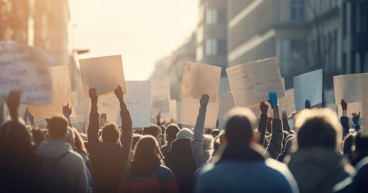 group of protesters with signs on a city street