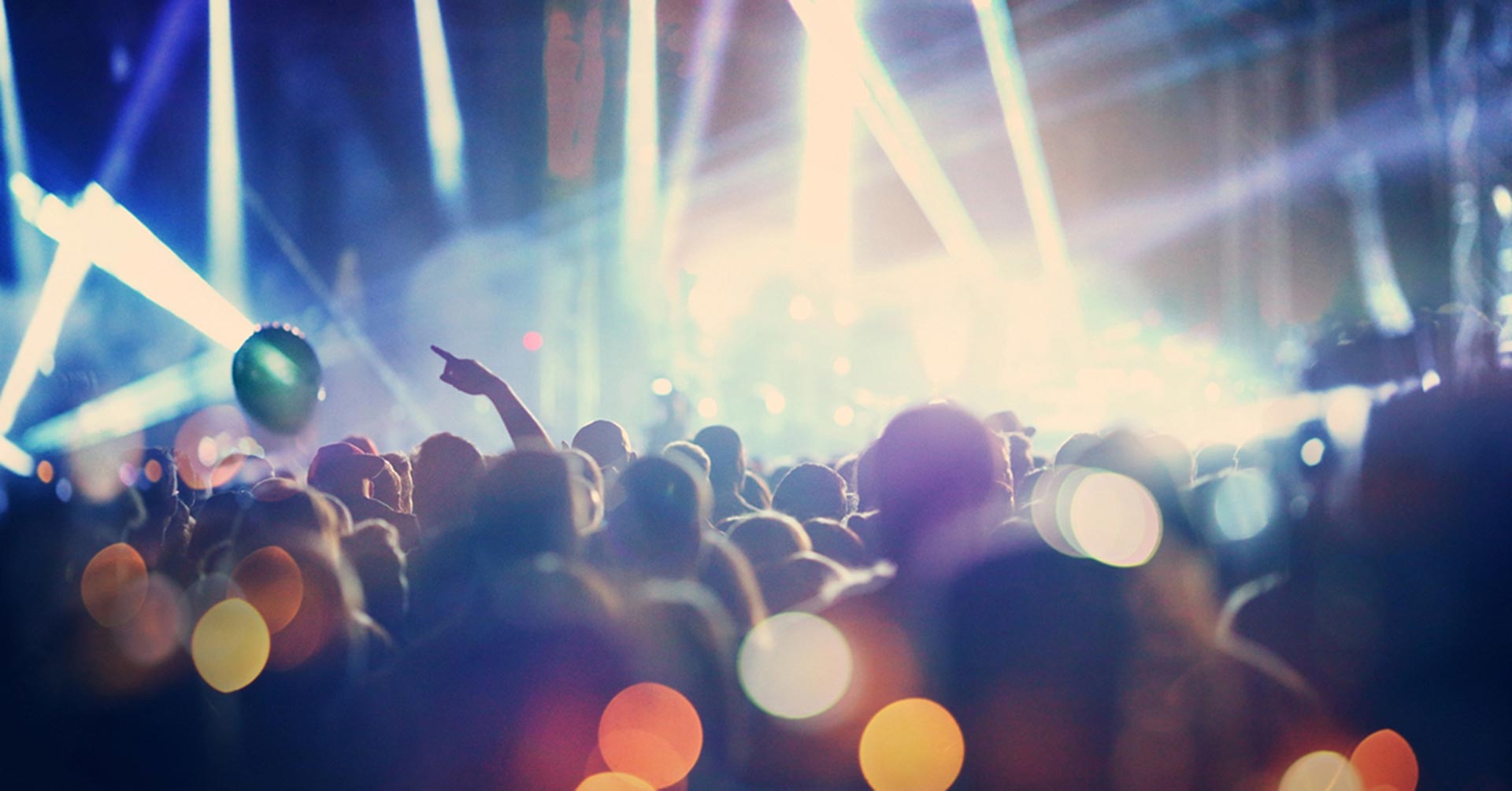 A crowded concert event with bokeh light effects