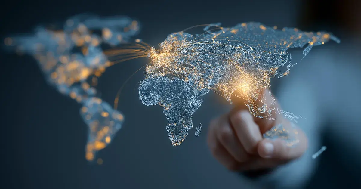 Hand interacting with a digital world map representing global monitoring to protect international operations.